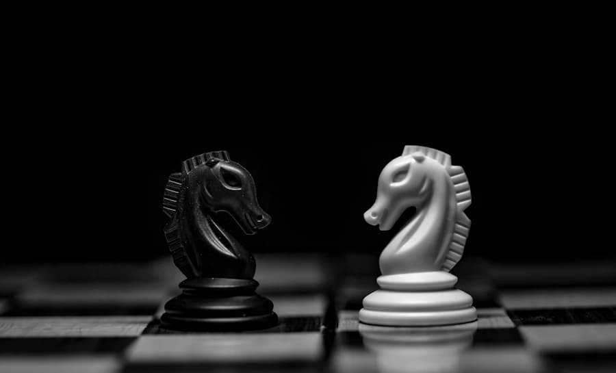 A black and a white knight facing each other