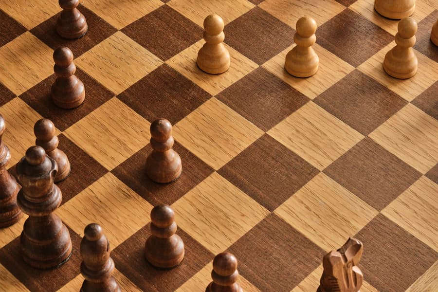 Wooden pieces on a wooden chessboard
