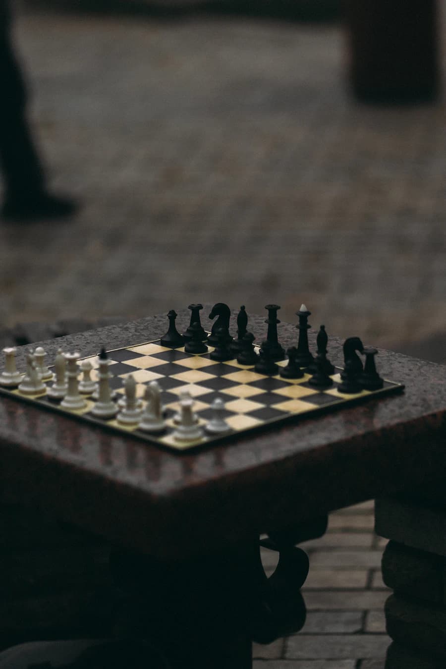 White and black pieces on a wooden board